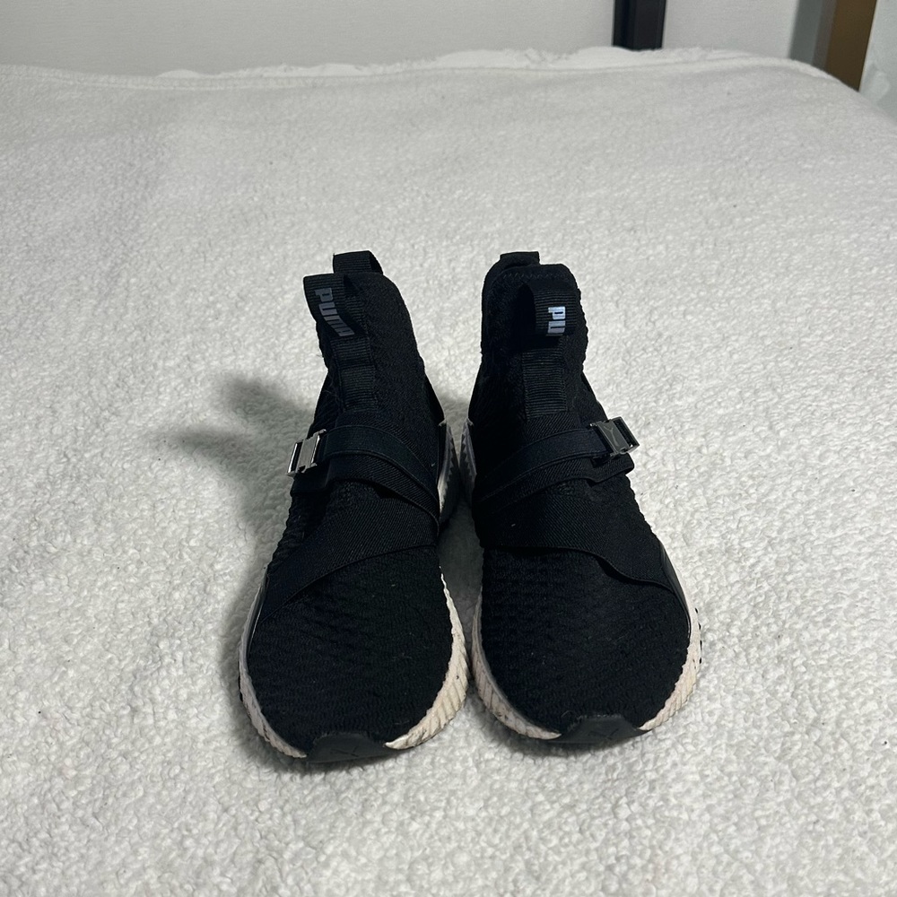 Black and fluorescent women puma shoes.